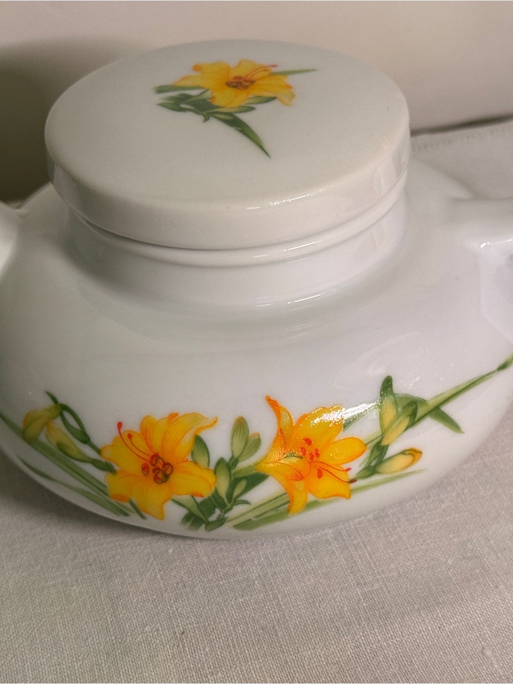 White Ceramic Decorative Jar with Yellow Floral Motif